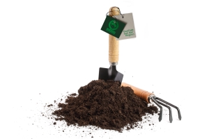 garden tools in soil isolated on white background